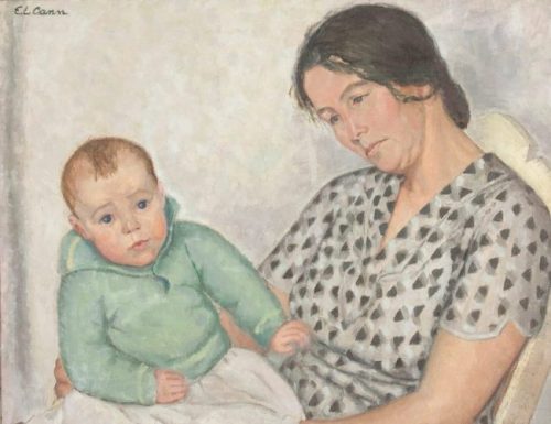 A mother holds her baby on her lap, her gaze cast downward and her face is in three quarter profile. She sits slumped in a chair with a high wooden back. Her greyish brown hair is tied back in a low updo. Her baby wears a mint green sweater and looks towards us.