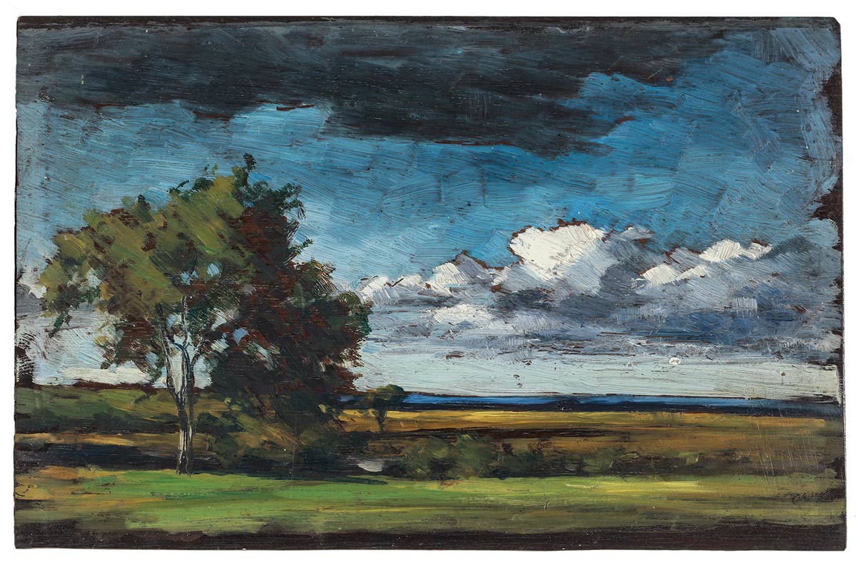 This pastoral landscape is composed in bands of colour: green grass, golden fields, and a sliver of blue ocean in the distance. Two small trees grow in the middle ground. A band of clouds sits close to the horizon in the deep blue sky.